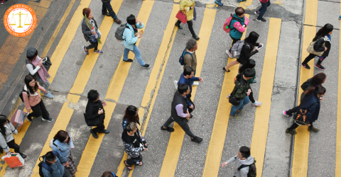 What are penalties for red light violations by pedestrians in 2025 in Vietnam? Is raising hands necessary when crossing the road in Vietnam?